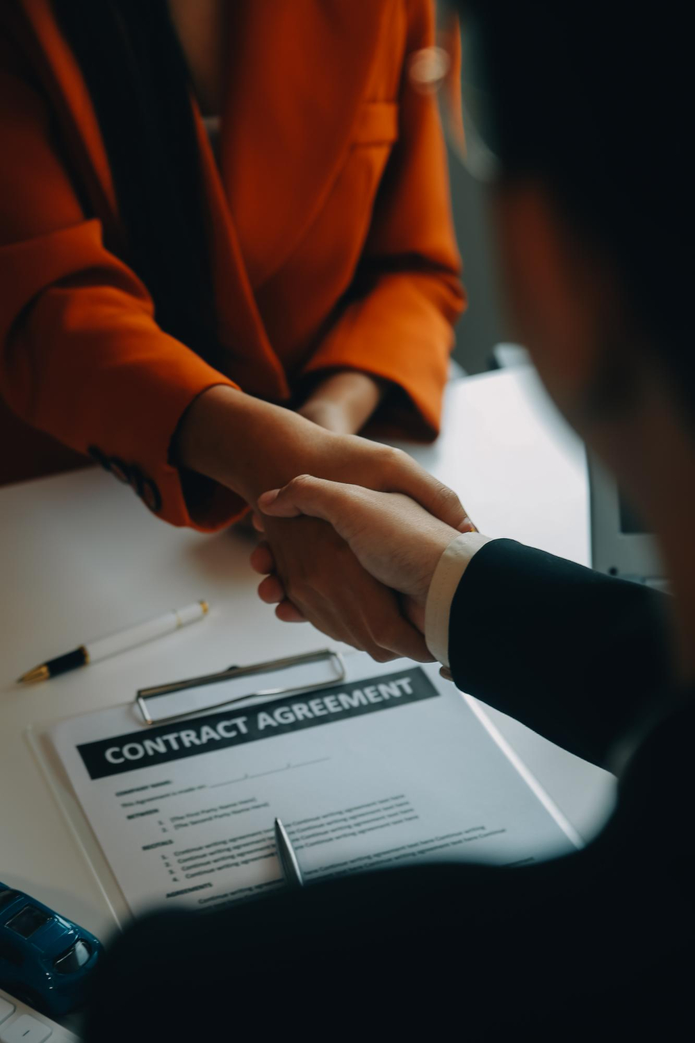 Brand and legal team reviewing celebrity endorsement agreement for compliance